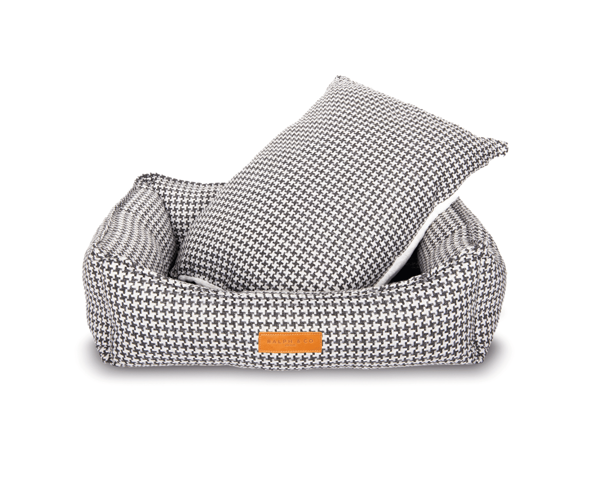 Luxury Ralph & Co Kensington houndstooth bolster nest dog bed with plush padding and supportive sides for cozy comfort.